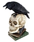статуэтка ворон на черепе и книгах
